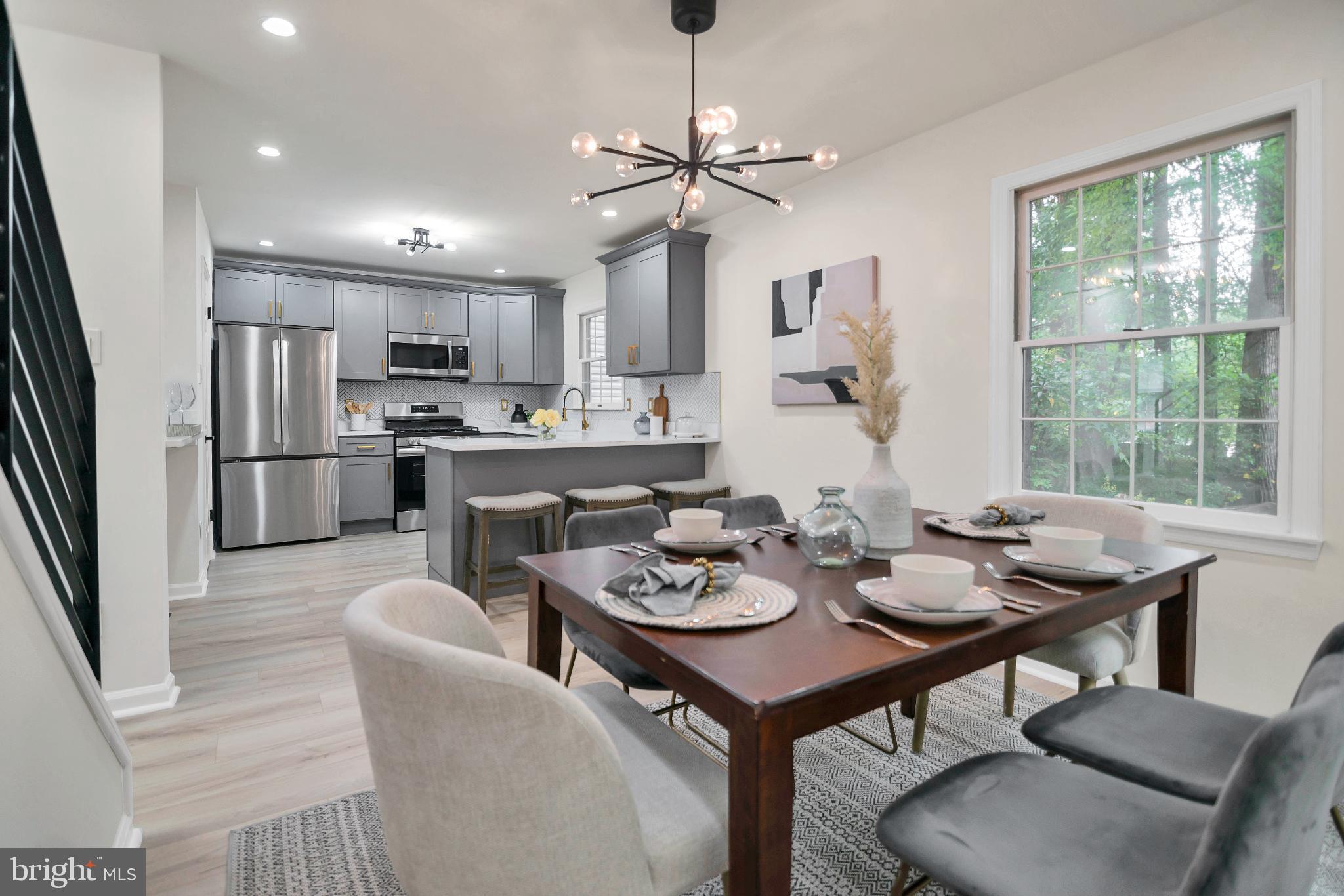 5809 Shana Place Burke, VA 22015 - Photo 20 of 46 a view of a dining room with furniture window and wooden floor