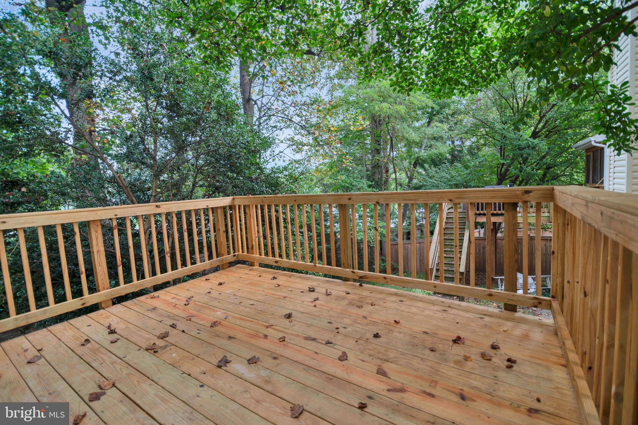5809 Shana Place Burke, VA 22015 - Photo 22 of 46 a view of wooden balcony