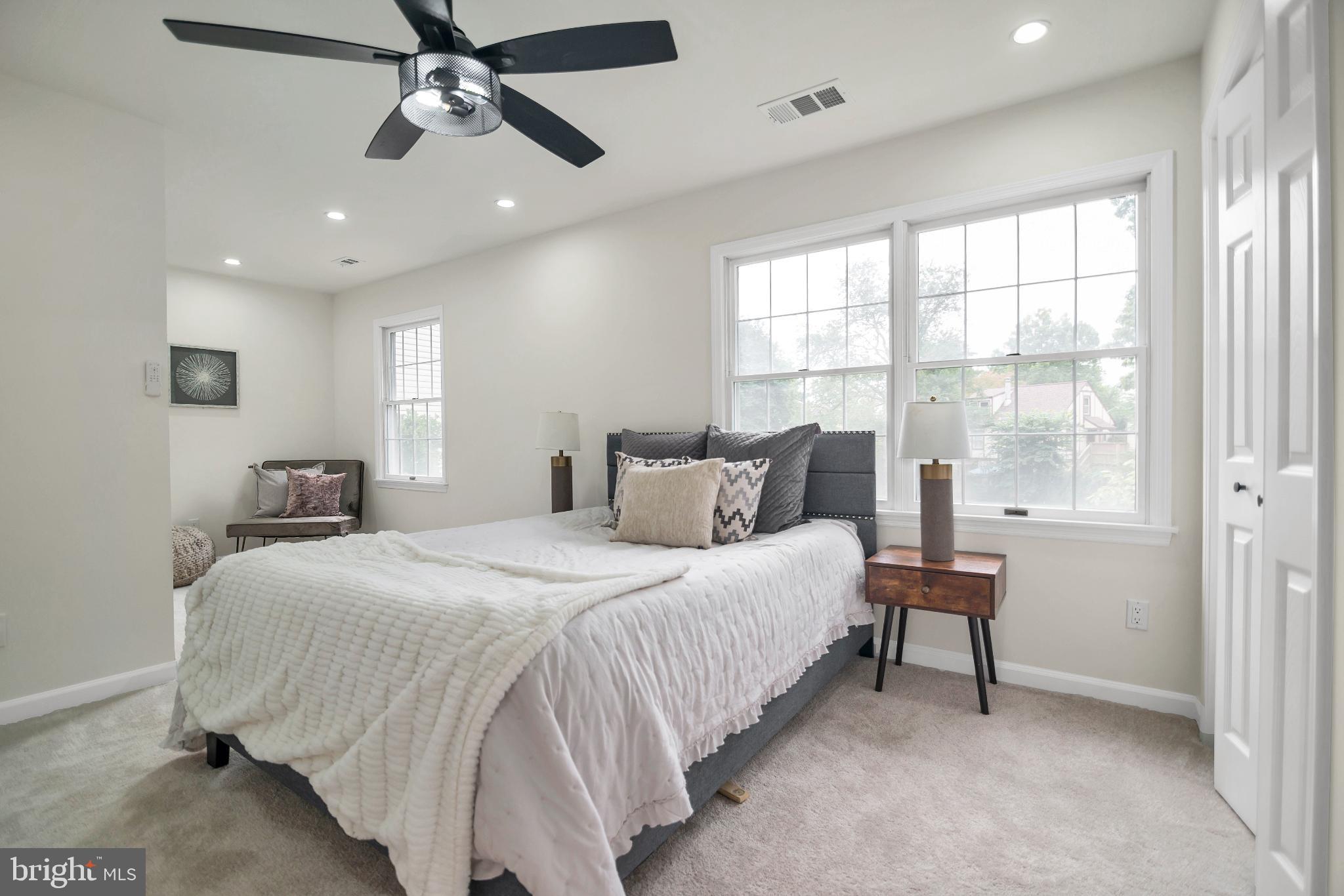 5809 Shana Place Burke, VA 22015 - Photo 25 of 46 a bedroom with a bed and a chandelier