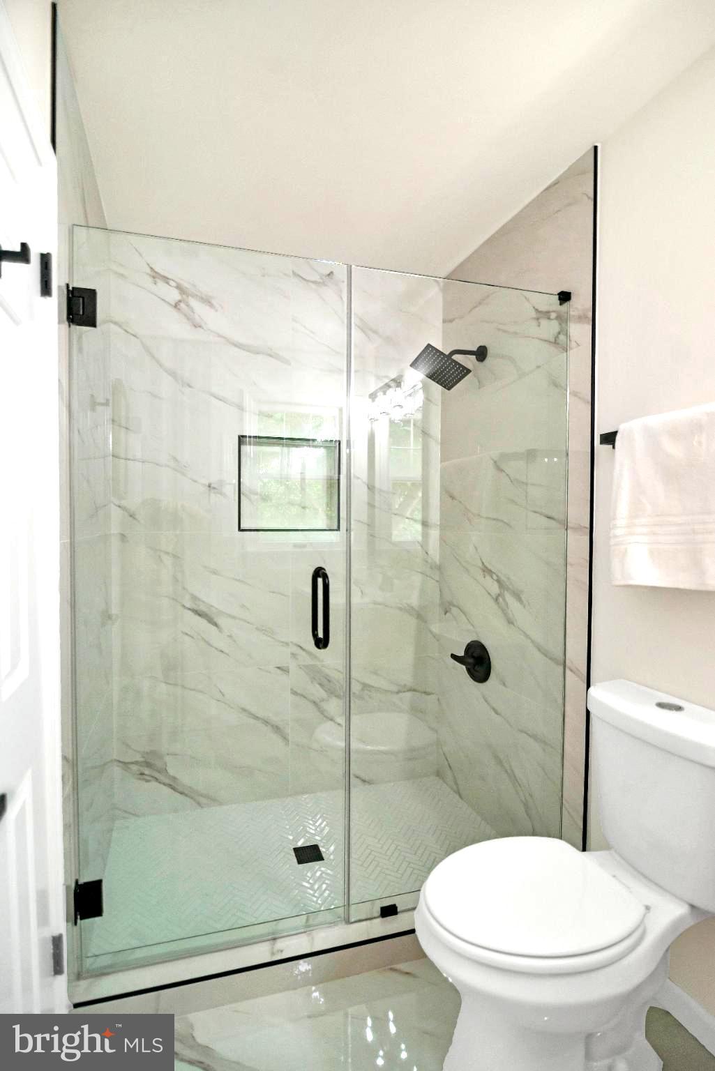 5809 Shana Place Burke, VA 22015 - Photo 27 of 46 a white toilet next to a bathroom