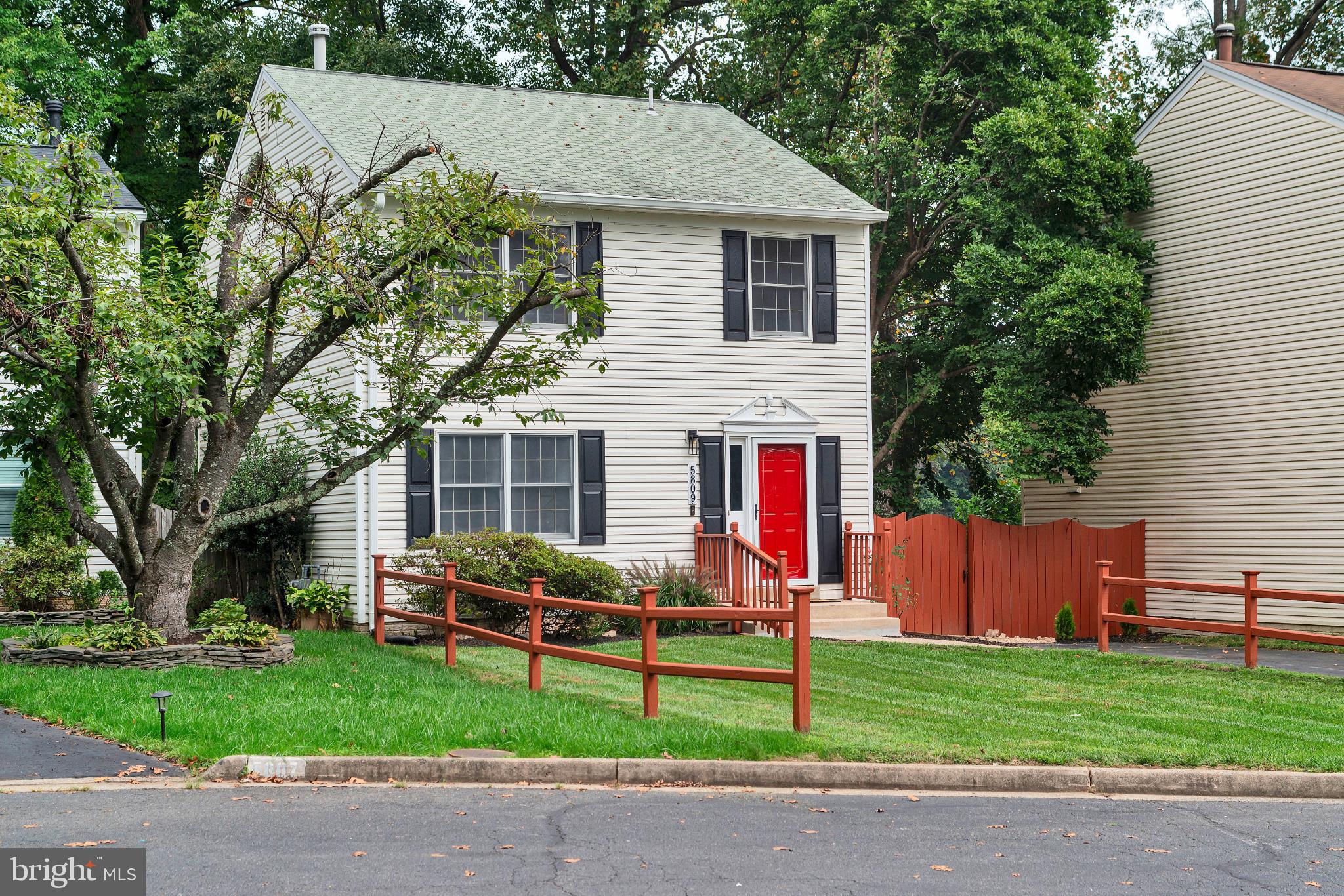 5809 Shana Place Burke, VA 22015 - Photo 3 of 46 a front view of a house with garden