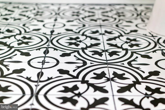 a view of a room with wooden floor and white doors