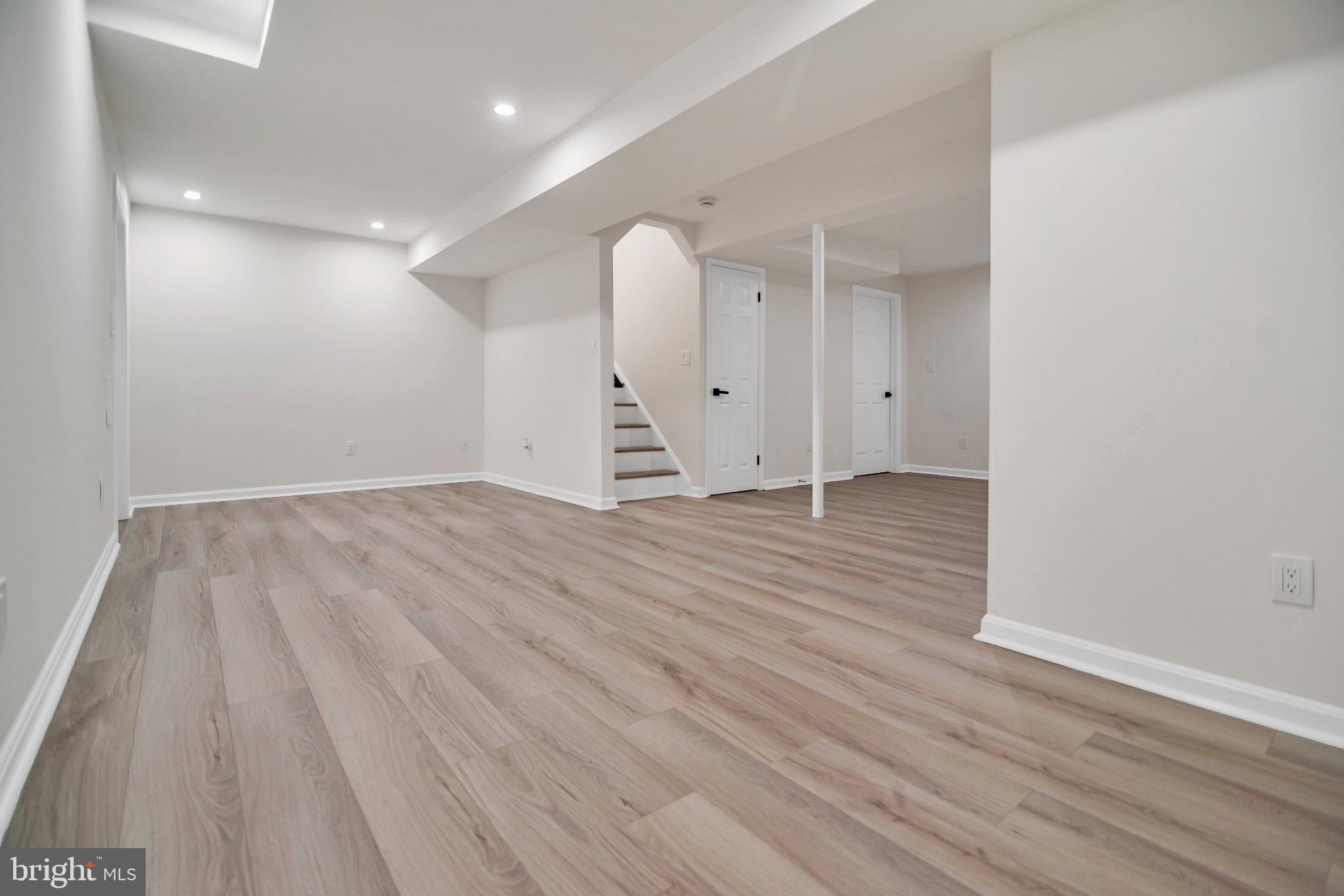 5809 Shana Place Burke, VA 22015 - Photo 37 of 46 wooden floor in an empty room with a window