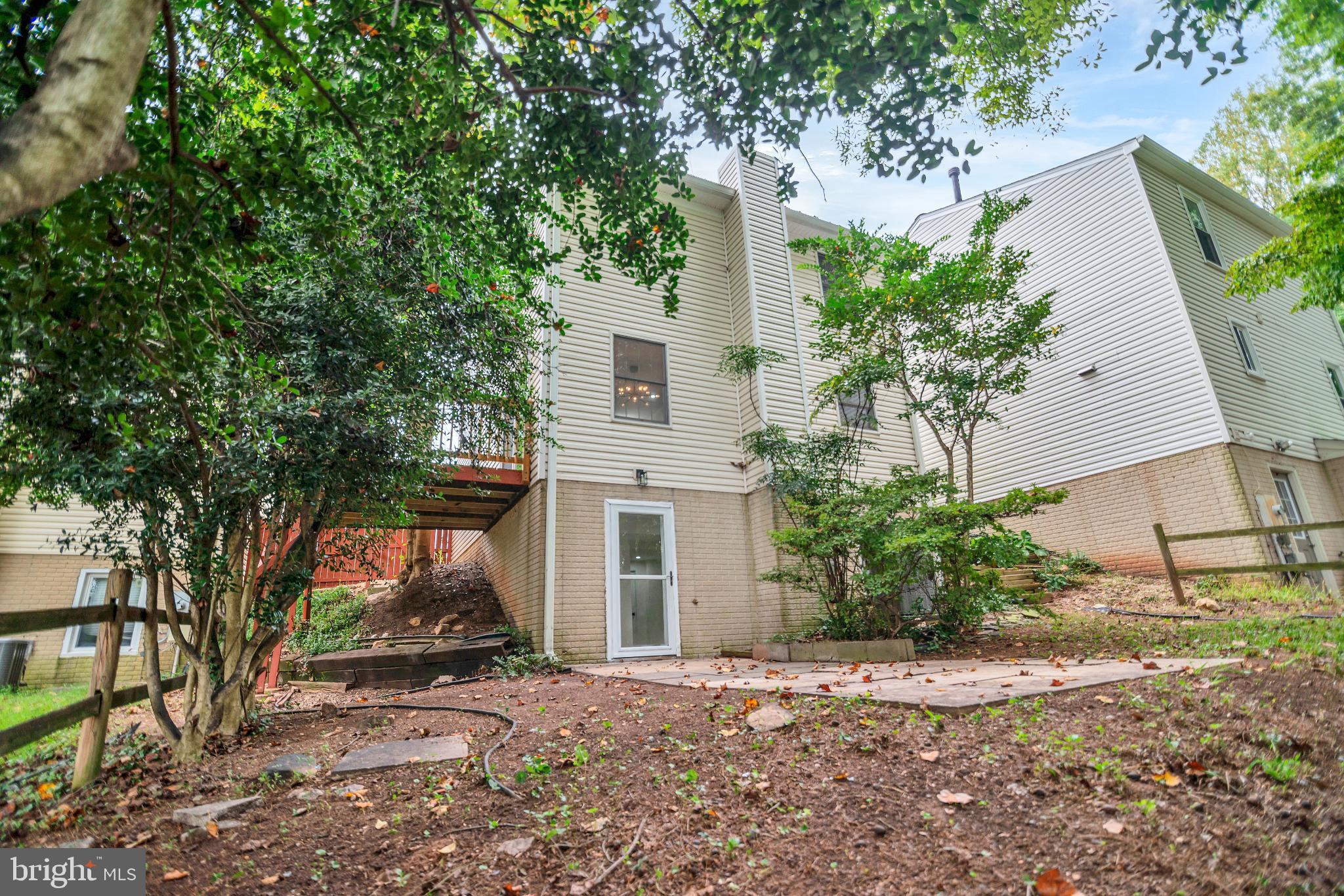 5809 Shana Place Burke, VA 22015 - Photo 43 of 46 a front view of a house with a yard and a garage