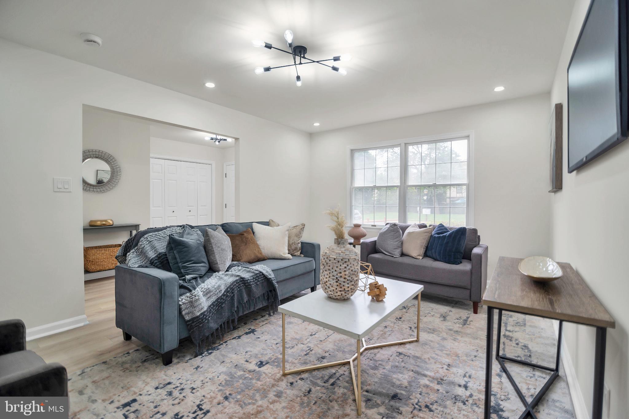 5809 Shana Place Burke, VA 22015 - Photo 5 of 46 a living room with furniture and a window