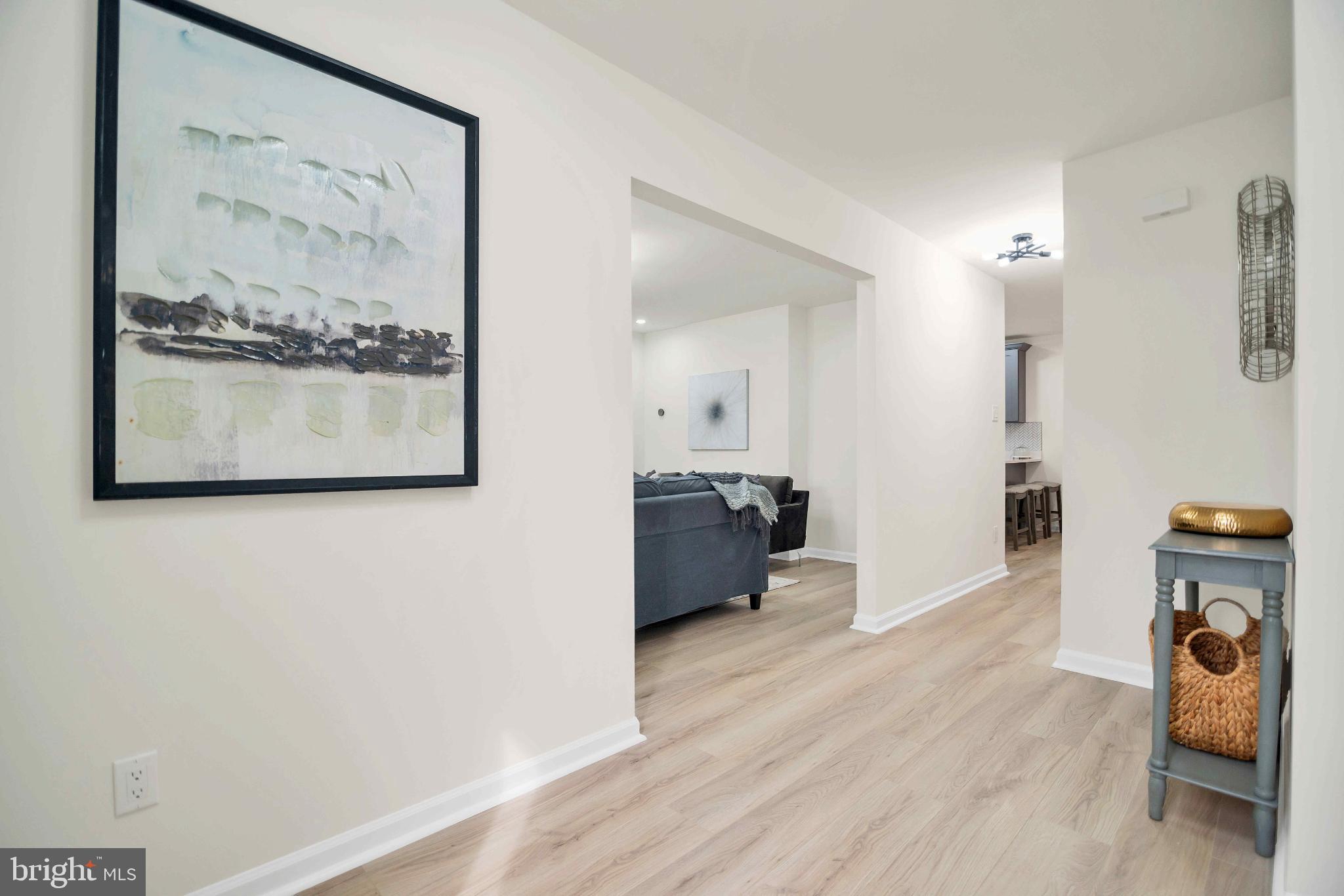 5809 Shana Place Burke, VA 22015 - Photo 9 of 46 a living room with furniture and a wooden floor