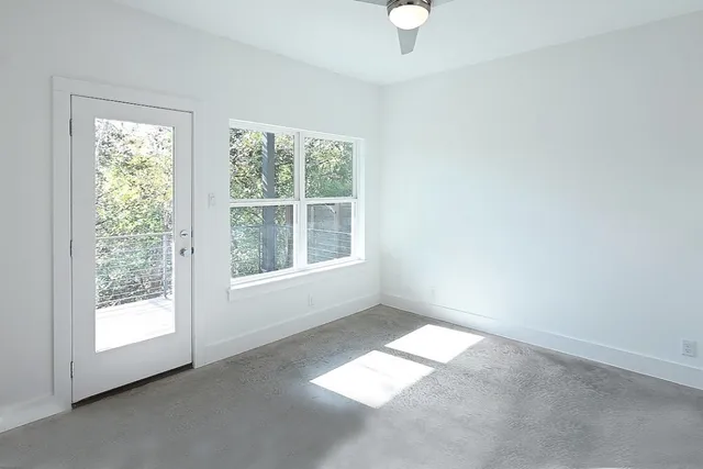 a view of a balcony with wooden floor and fence