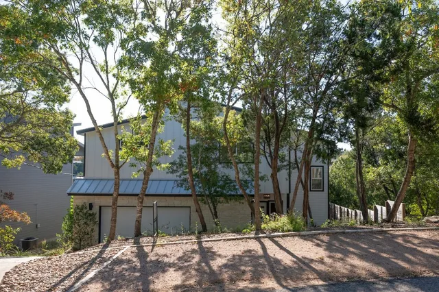an aerial view of a house with yard and outdoor seating