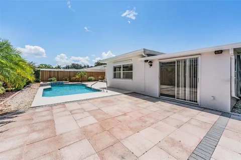 a view of a house with a backyard