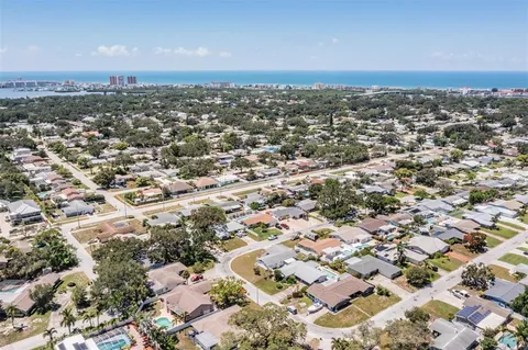 an aerial view of residential building with green space