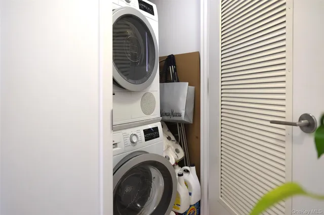 a close view of a utility room with dryer and washer