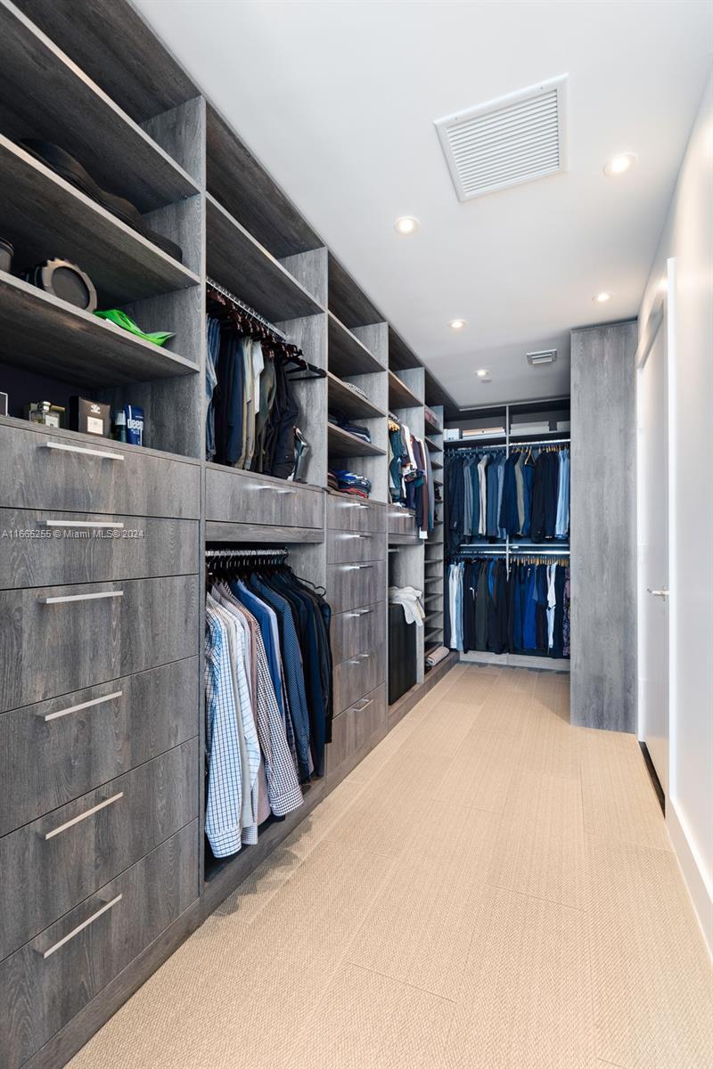 900 Biscayne Boulevard, Unit 3609 Miami, FL 33132 - Photo 15 of 36 a view of walk in closet with clothes and shoes