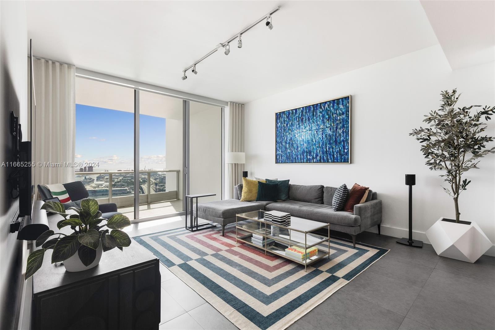 900 Biscayne Boulevard, Unit 3609 Miami, FL 33132 - Photo 2 of 36 a living room with furniture and a large window