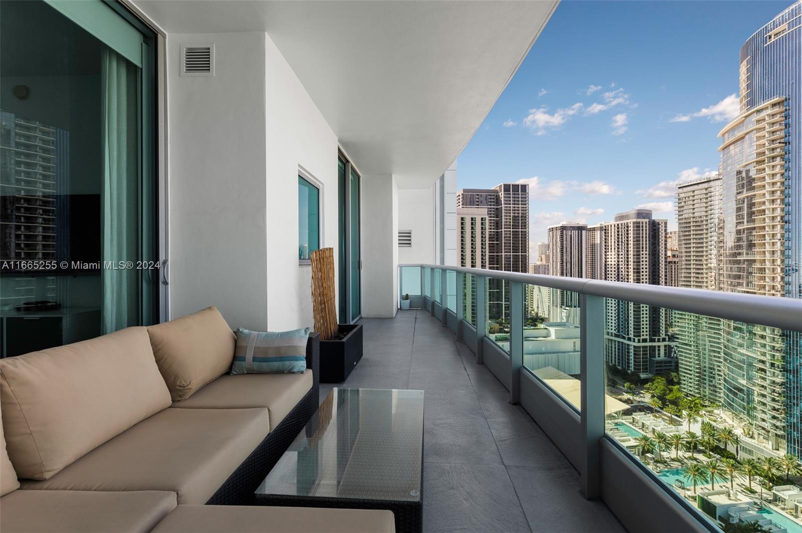 900 Biscayne Boulevard, Unit 3609 Miami, FL 33132 - Photo 25 of 36 a balcony with furniture and a potted plant
