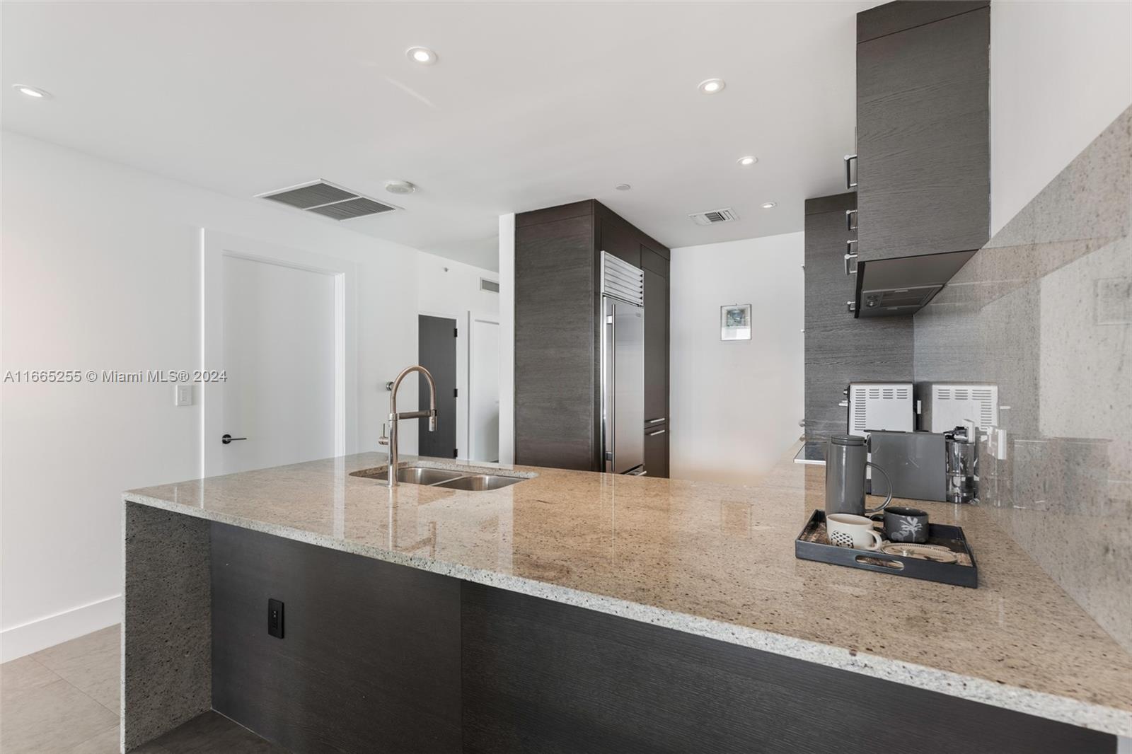 900 Biscayne Boulevard, Unit 3609 Miami, FL 33132 - Photo 7 of 36 a bathroom with a sink double vanity