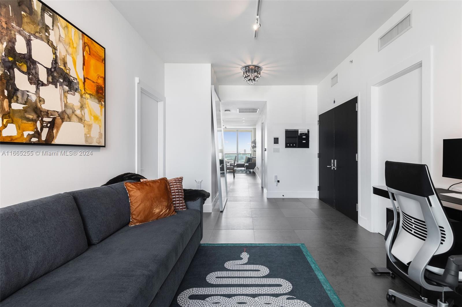 900 Biscayne Boulevard, Unit 3609 Miami, FL 33132 - Photo 9 of 36 a living room with furniture and a flat screen tv