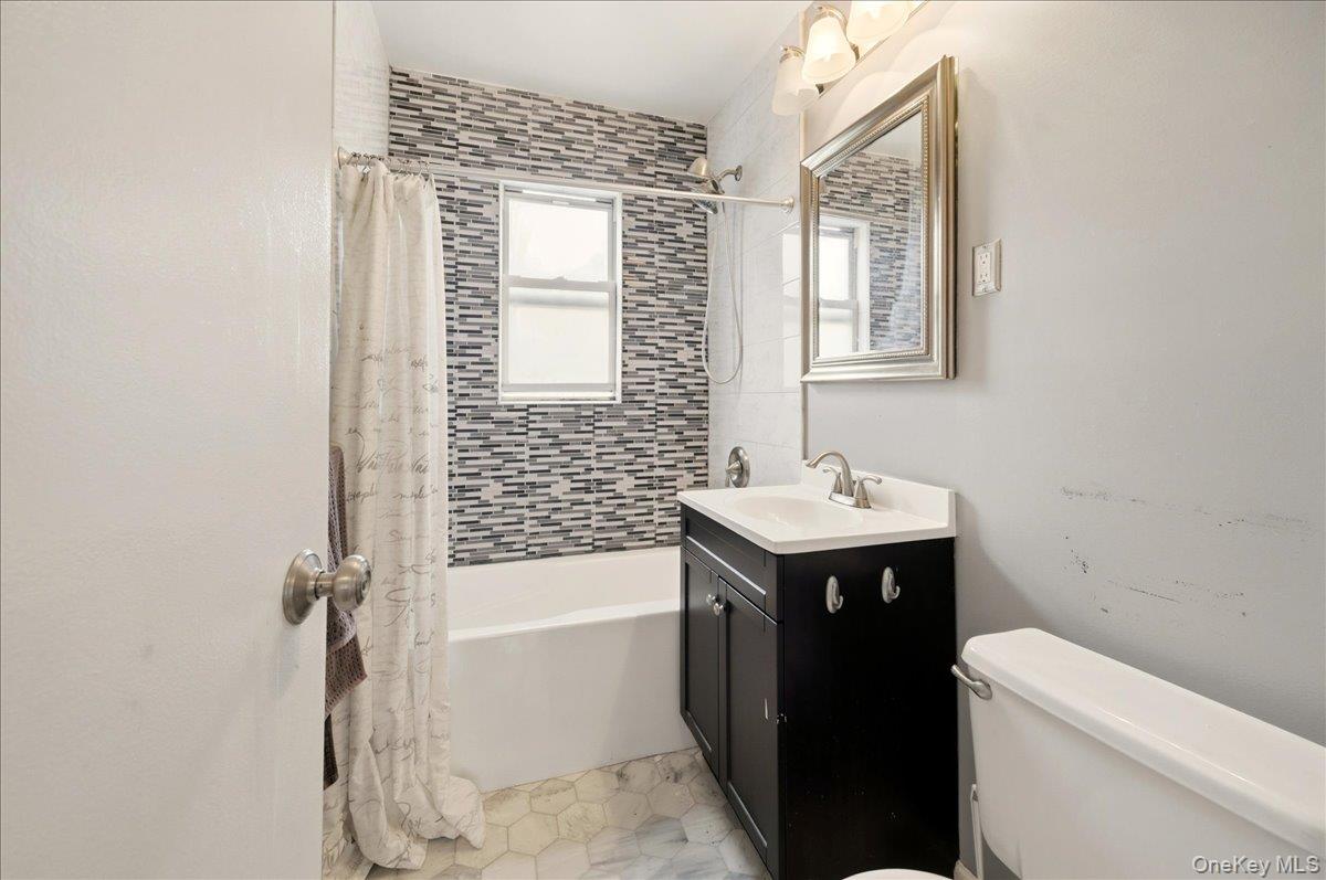 186 Pinewood Road, Unit 56 Hartsdale, NY 10530 - Photo 15 of 20 a bathroom with a sink a toilet and shower