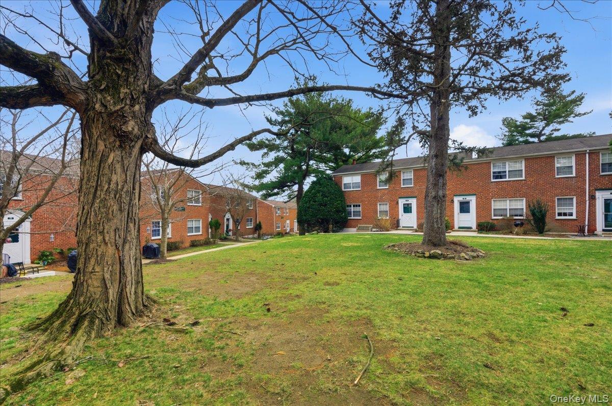 186 Pinewood Road, Unit 56 Hartsdale, NY 10530 - Photo 2 of 20 a view of a house with a yard