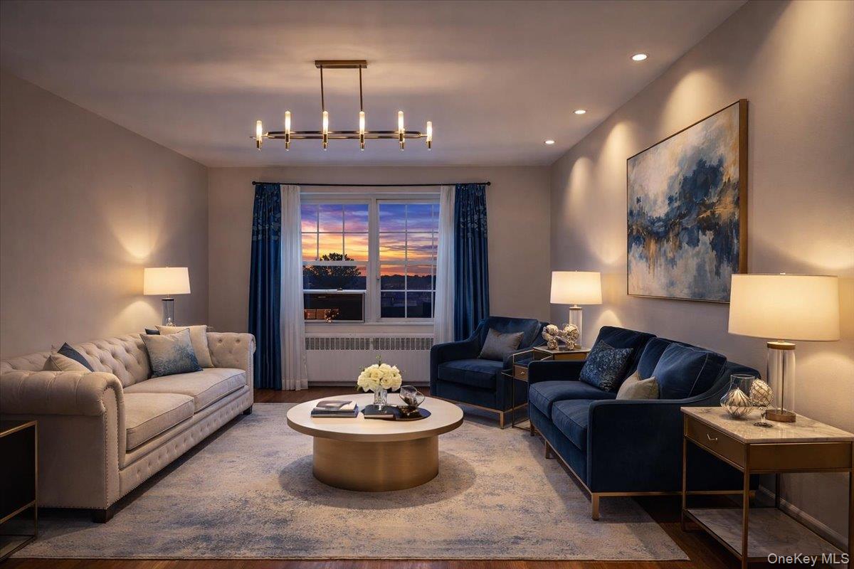 186 Pinewood Road, Unit 56 Hartsdale, NY 10530 - Photo 3 of 20 a living room with furniture and a chandelier