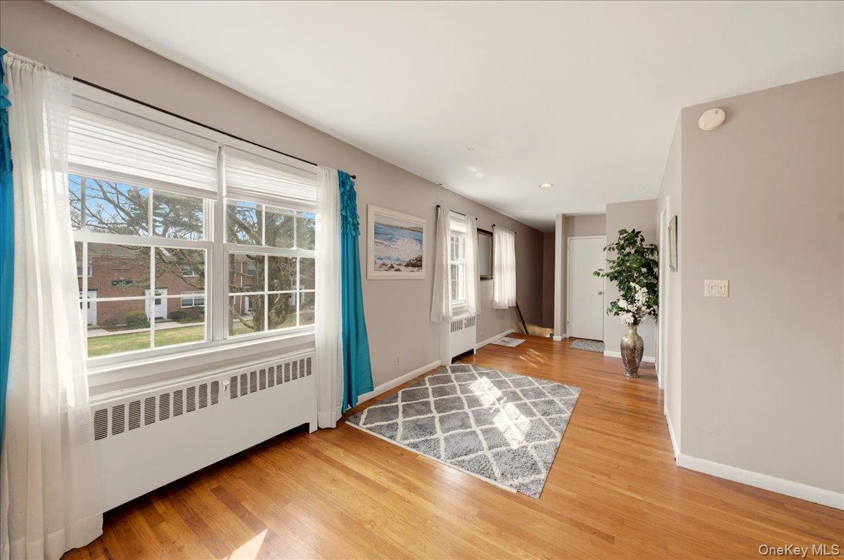 186 Pinewood Road, Unit 56 Hartsdale, NY 10530 - Photo 5 of 20 an empty room with windows