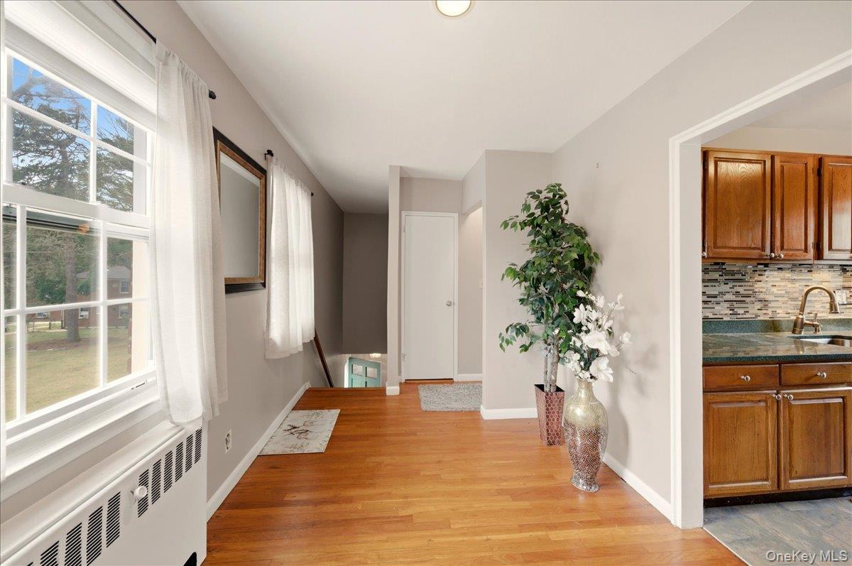 186 Pinewood Road, Unit 56 Hartsdale, NY 10530 - Photo 6 of 20 a spacious bedroom with a balcony a bed and a potted plant