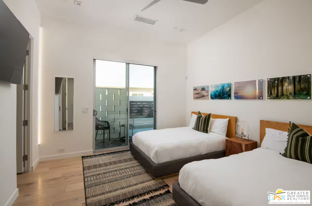 89022 Elemento Lane Indio, CA 92201 - Photo 11 of 31 a bedroom with two beds and large window