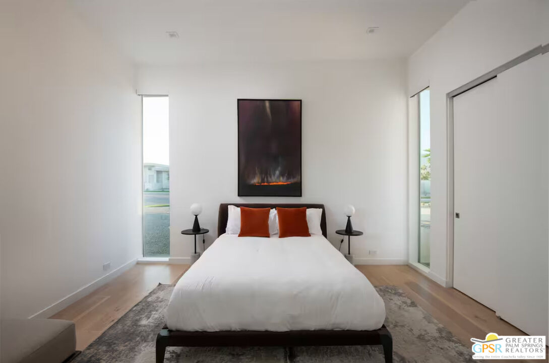 89022 Elemento Lane Indio, CA 92201 - Photo 16 of 31 a bedroom with a bed and mirror