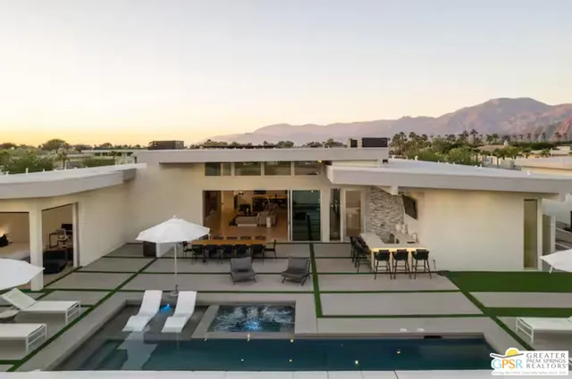 a front view of house with outdoor seating