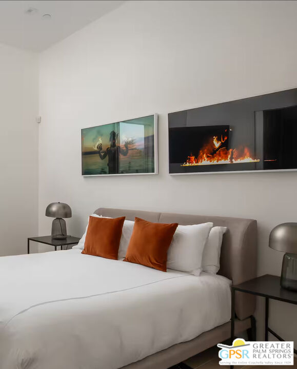 89022 Elemento Lane Indio, CA 92201 - Photo 10 of 31 a bedroom with a bed and flat screen tv