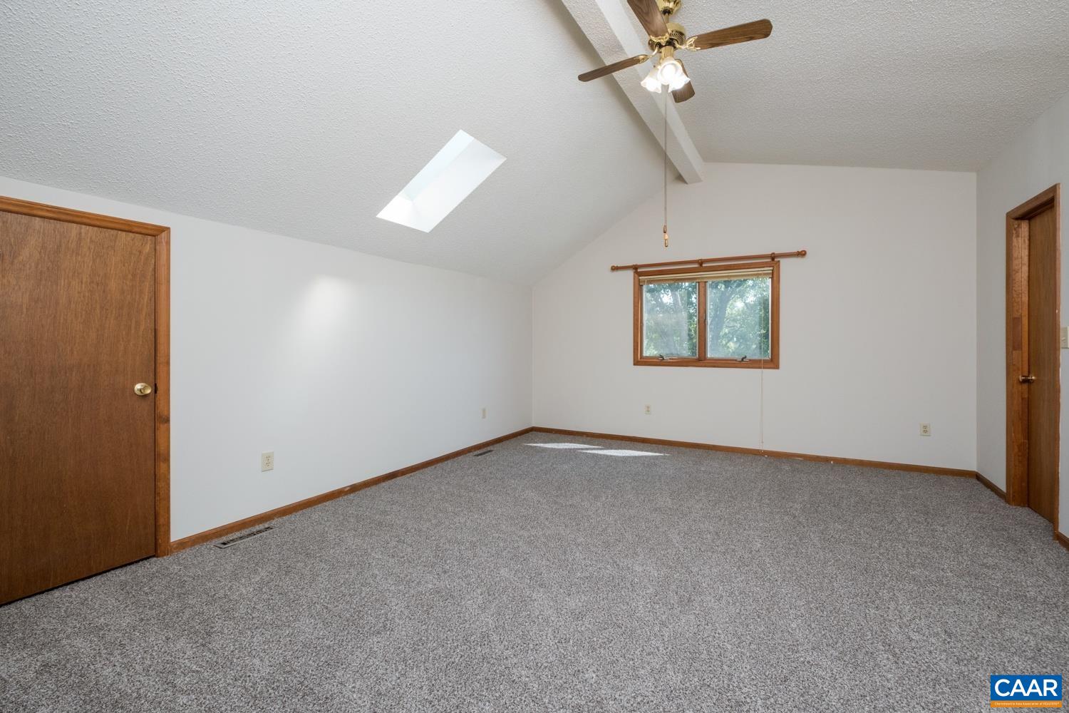634 Augusta Farms Road Waynesboro, VA 22980 - Photo 18 of 32 an empty room with windows and ceiling fan
