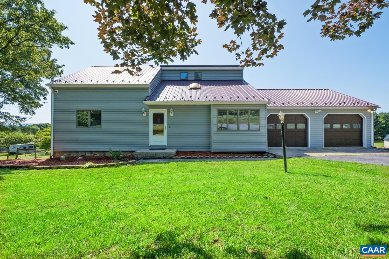 634 Augusta Farms Road Waynesboro, VA 22980 - Photo 2 of 32 a front view of a house with a yard and garage