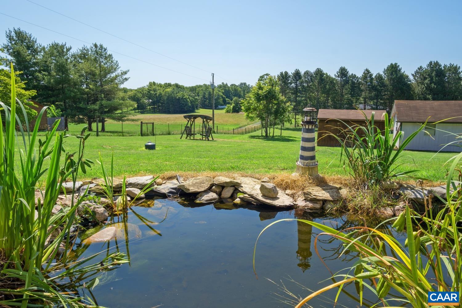 634 Augusta Farms Road Waynesboro, VA 22980 - Photo 4 of 32 a view of a table and chairs in the garden