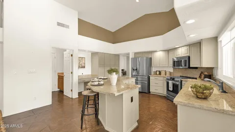 a view of a patio with table and chairs potted plants with wooden floor
