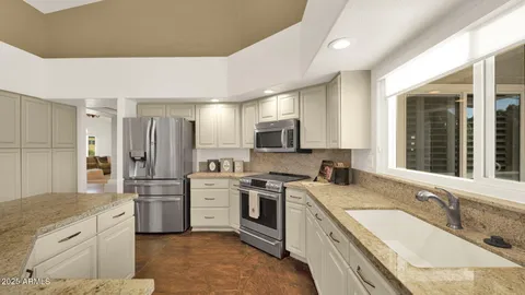 a front view of a building with outdoor seating space