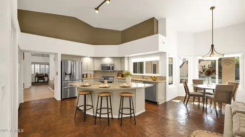 a bed room with a bed and a chandelier