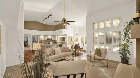 a bedroom with furniture and a chandelier