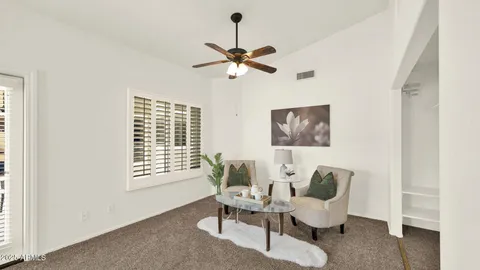 a bathroom with a sink a toilet and a shower curtain