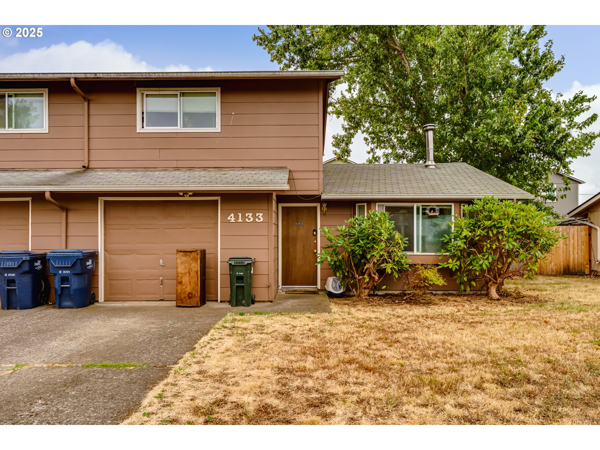 4133-4135 Bluebelle Way Springfield, OR 97478 - Photo 3 of 4 a view of a house with a patio