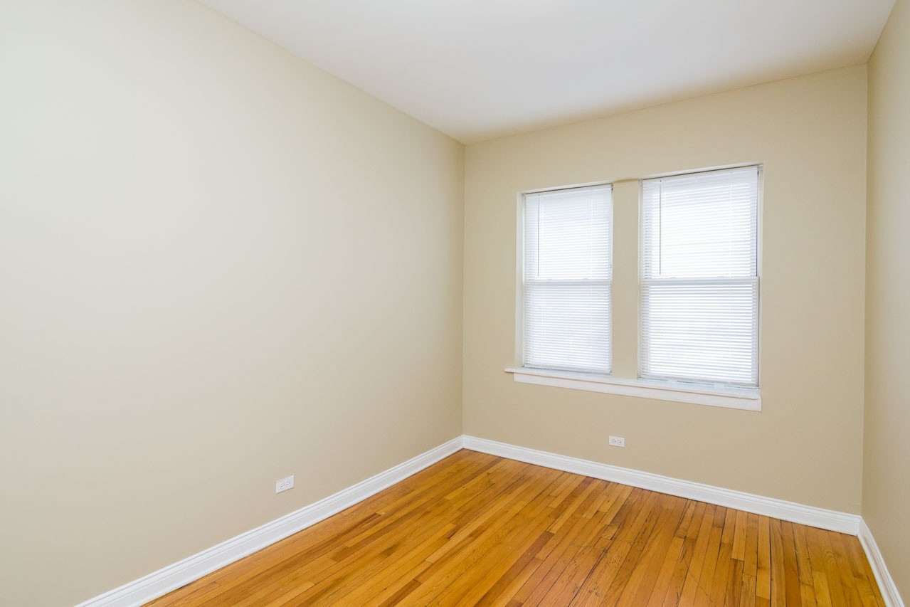 4439 West Fullerton Avenue, Unit 2 Chicago, IL 60639 - Photo 6 of 8 an empty room with a window