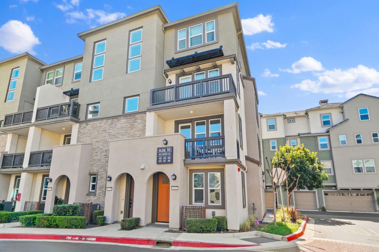 a front view of a multi story residential apartment building