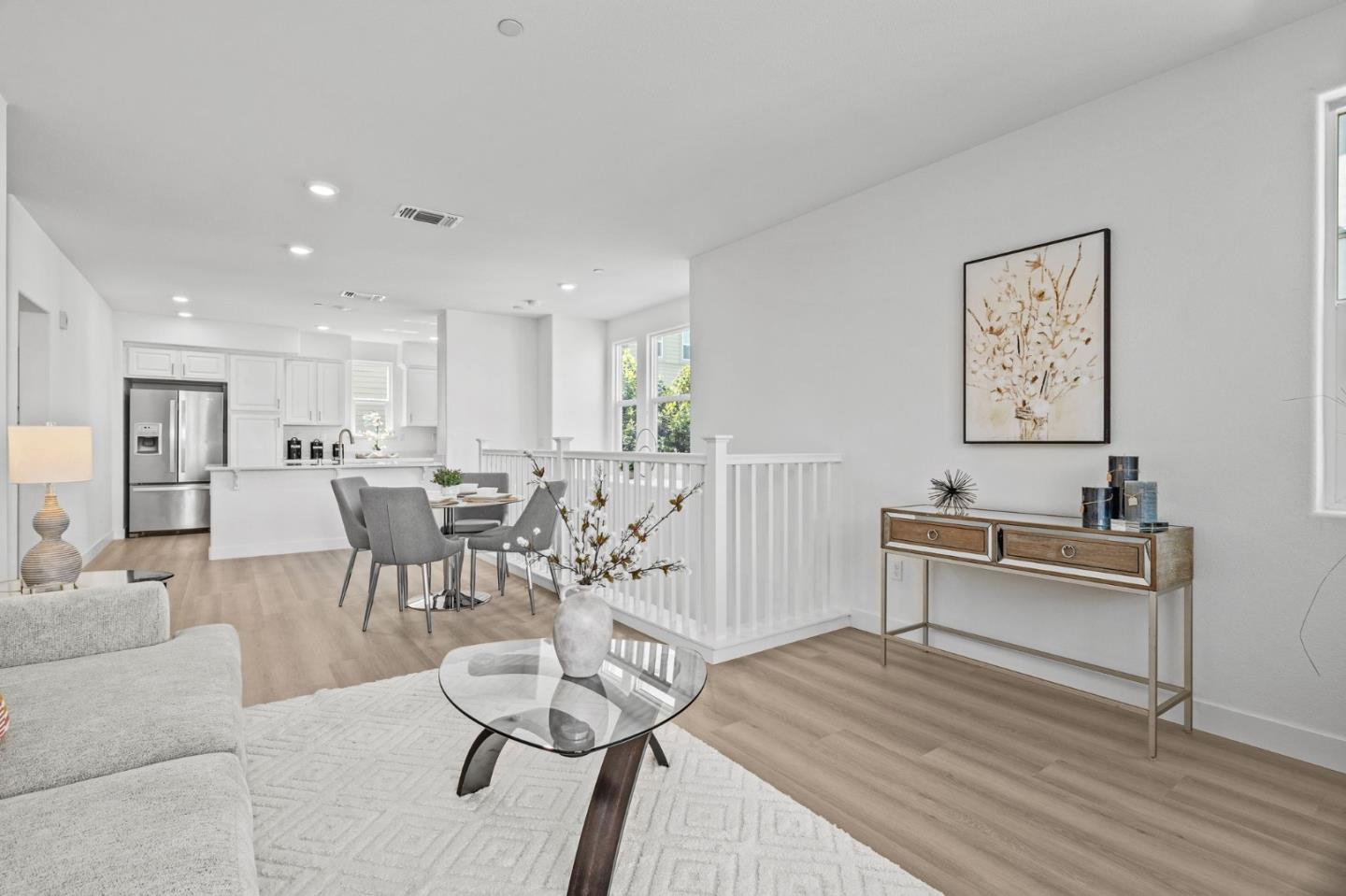 1453 Cherry Circle Milpitas, CA 95035 - Photo 11 of 53 a living room with furniture a dining table and kitchen view