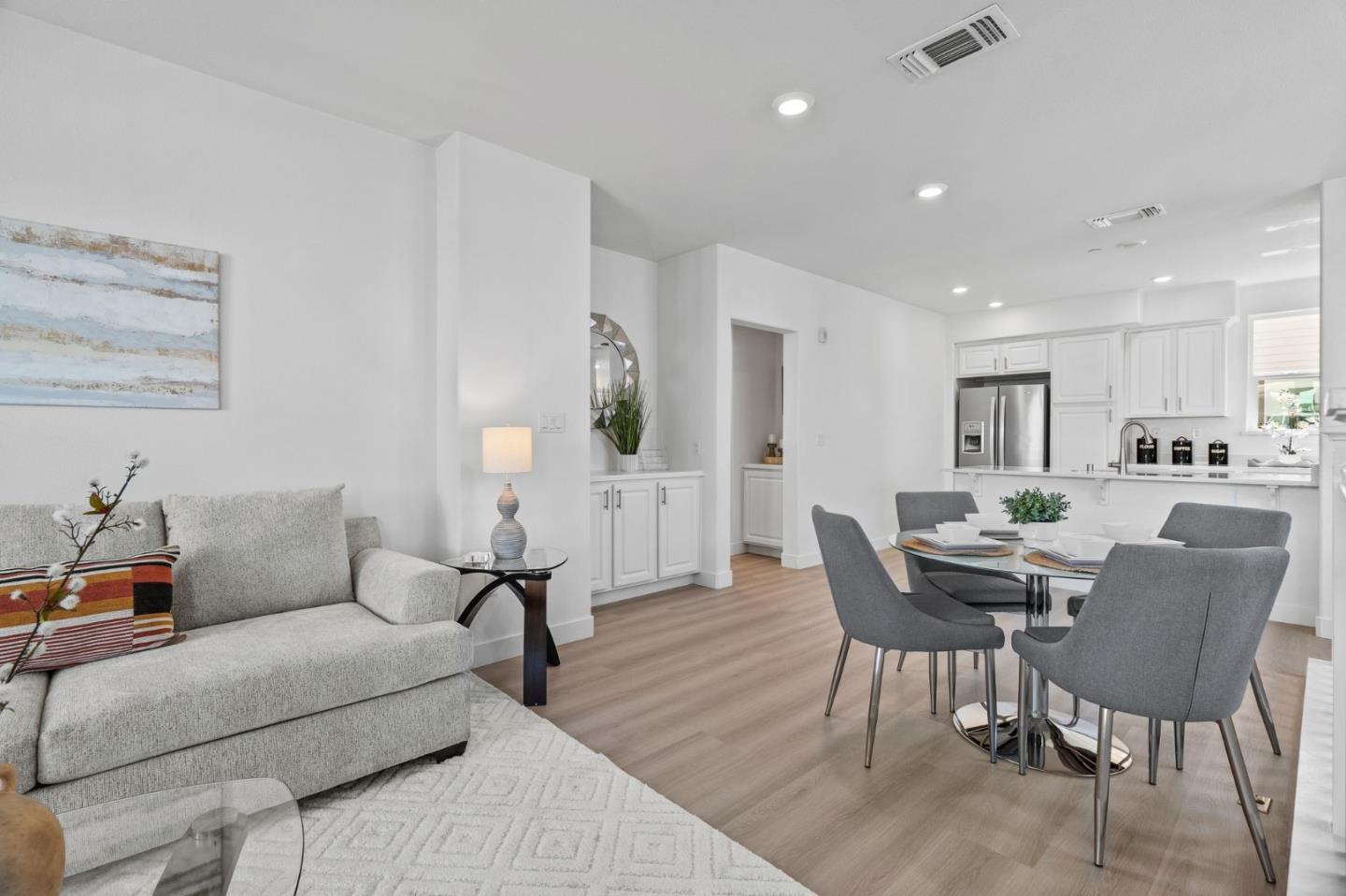 1453 Cherry Circle Milpitas, CA 95035 - Photo 14 of 53 a living room with furniture and a dining table with chairs