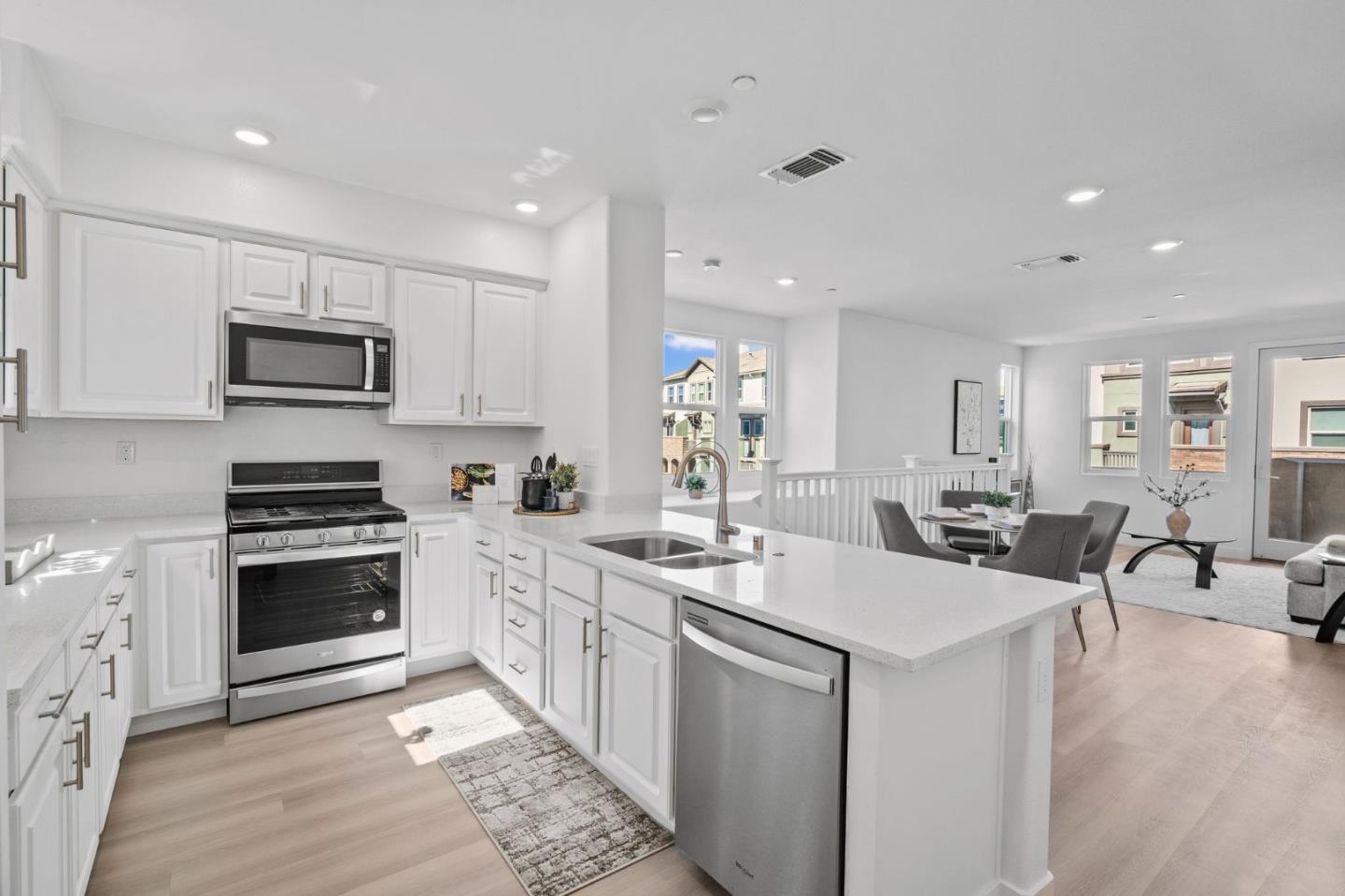 1453 Cherry Circle Milpitas, CA 95035 - Photo 17 of 53 a kitchen with stainless steel appliances kitchen island granite countertop a sink and cabinets