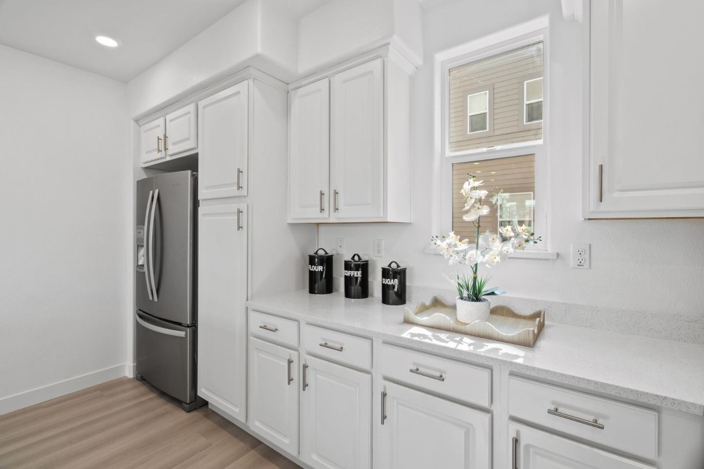 1453 Cherry Circle Milpitas, CA 95035 - Photo 20 of 53 a kitchen with stainless steel appliances white cabinets and a refrigerator