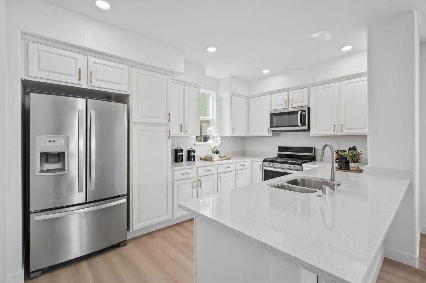 1453 Cherry Circle Milpitas, CA 95035 - Photo 21 of 53 a kitchen with stainless steel appliances a refrigerator stove microwave and sink
