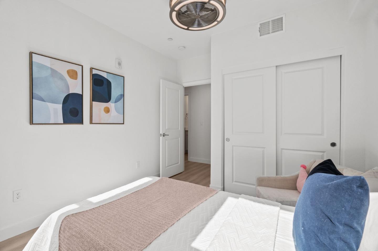 1453 Cherry Circle Milpitas, CA 95035 - Photo 28 of 53 a bedroom with a bed and painting on the wall