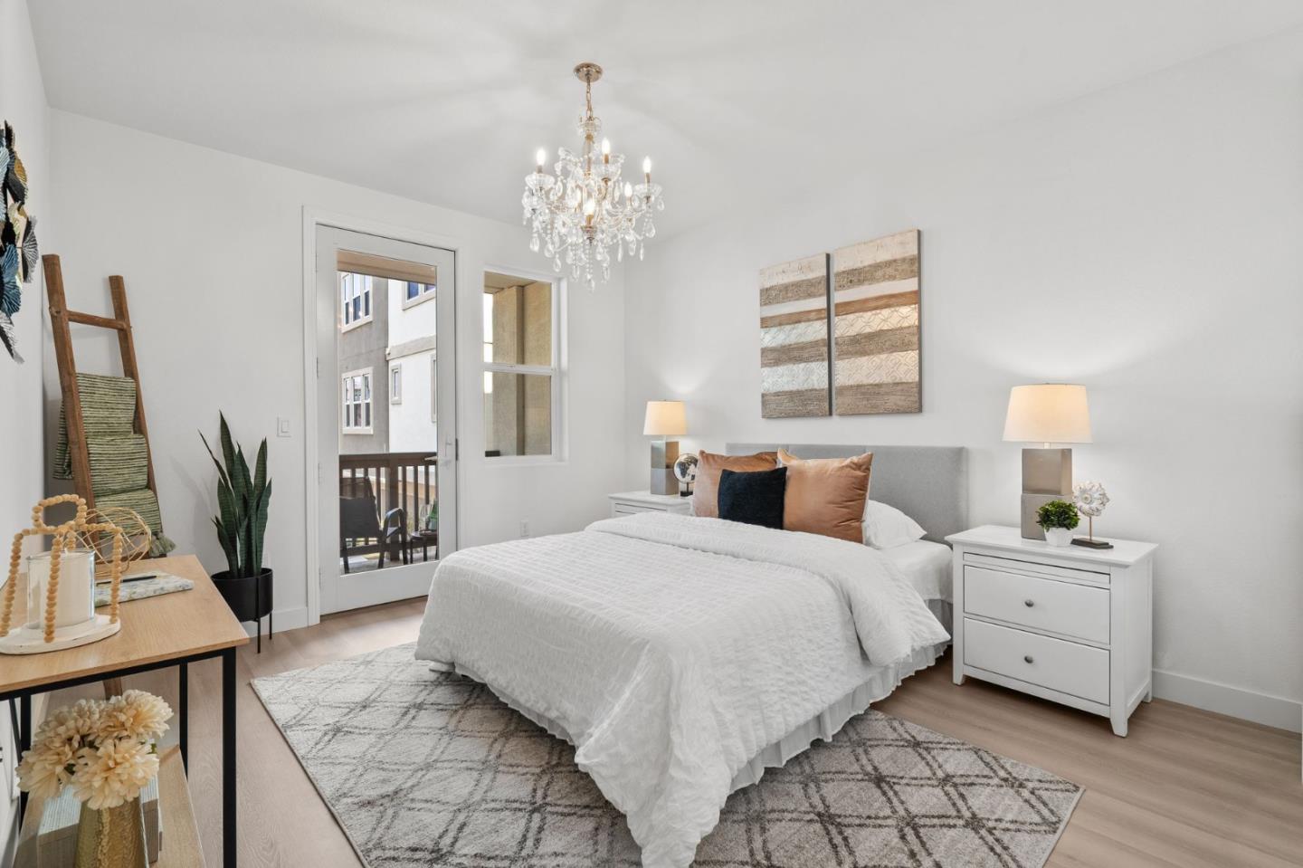 1453 Cherry Circle Milpitas, CA 95035 - Photo 32 of 53 a spacious bedroom with a bed and a chandelier