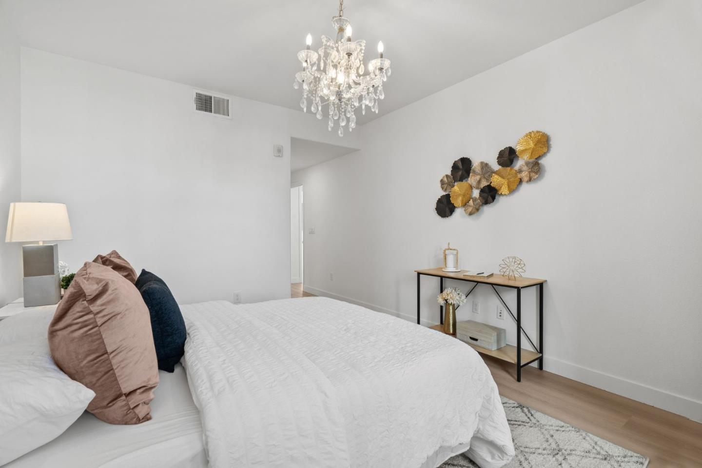 1453 Cherry Circle Milpitas, CA 95035 - Photo 33 of 53 a bedroom with a bed and a chandelier