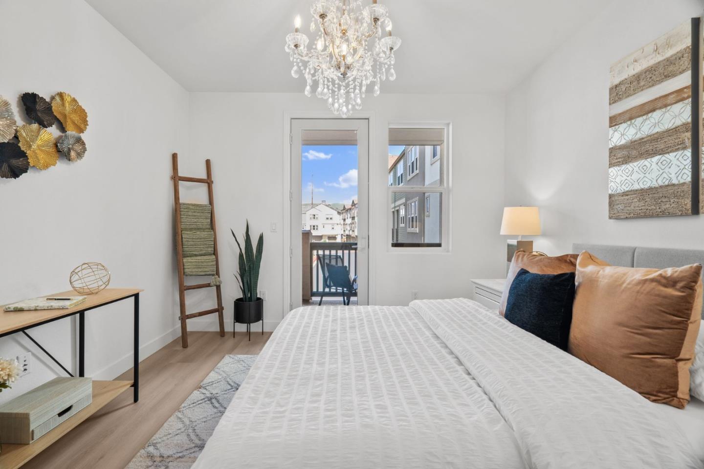 1453 Cherry Circle Milpitas, CA 95035 - Photo 34 of 53 a bedroom with a bed and a chandelier