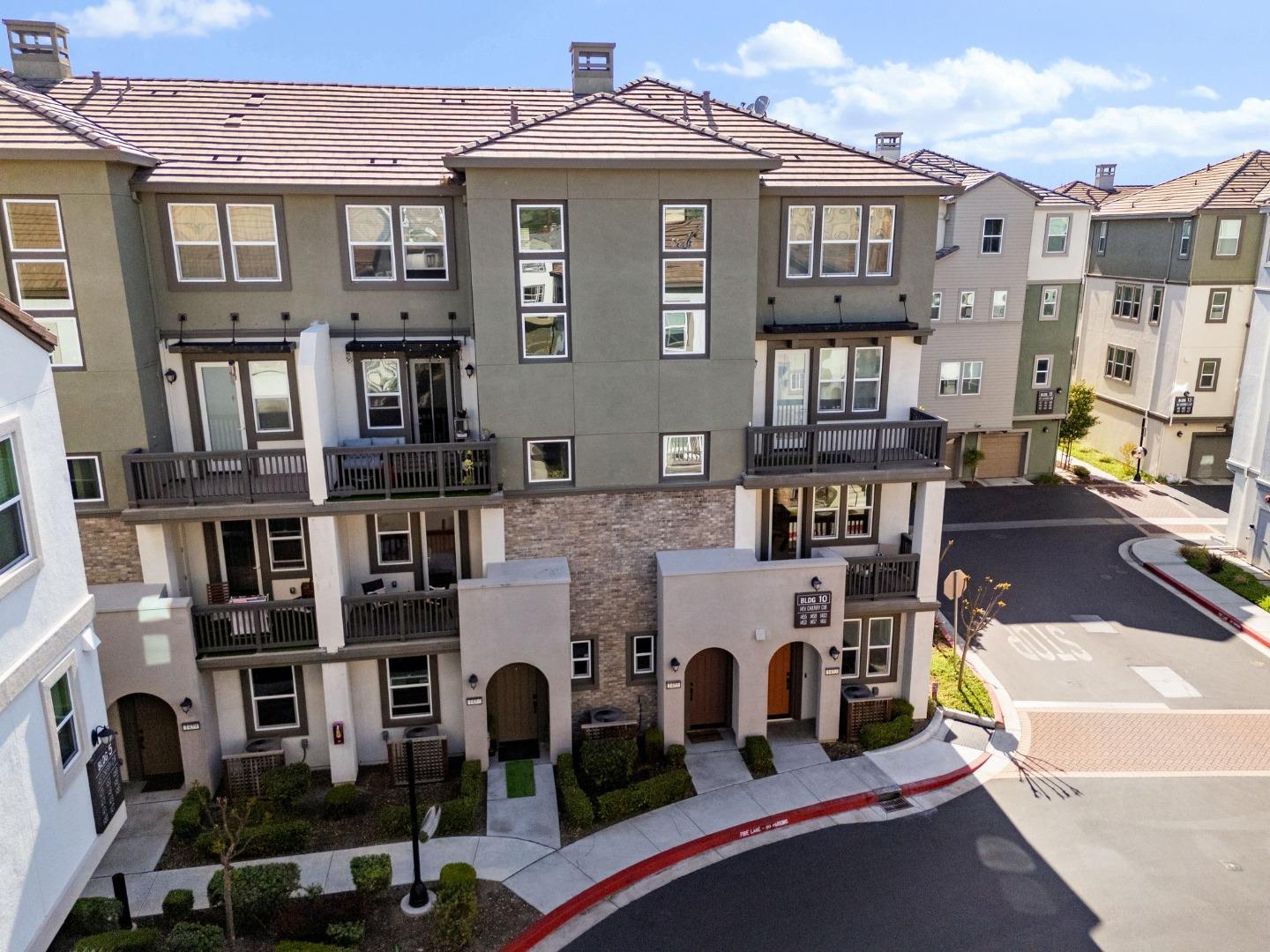 1453 Cherry Circle Milpitas, CA 95035 - Photo 45 of 53 a front view of a building with glass windows